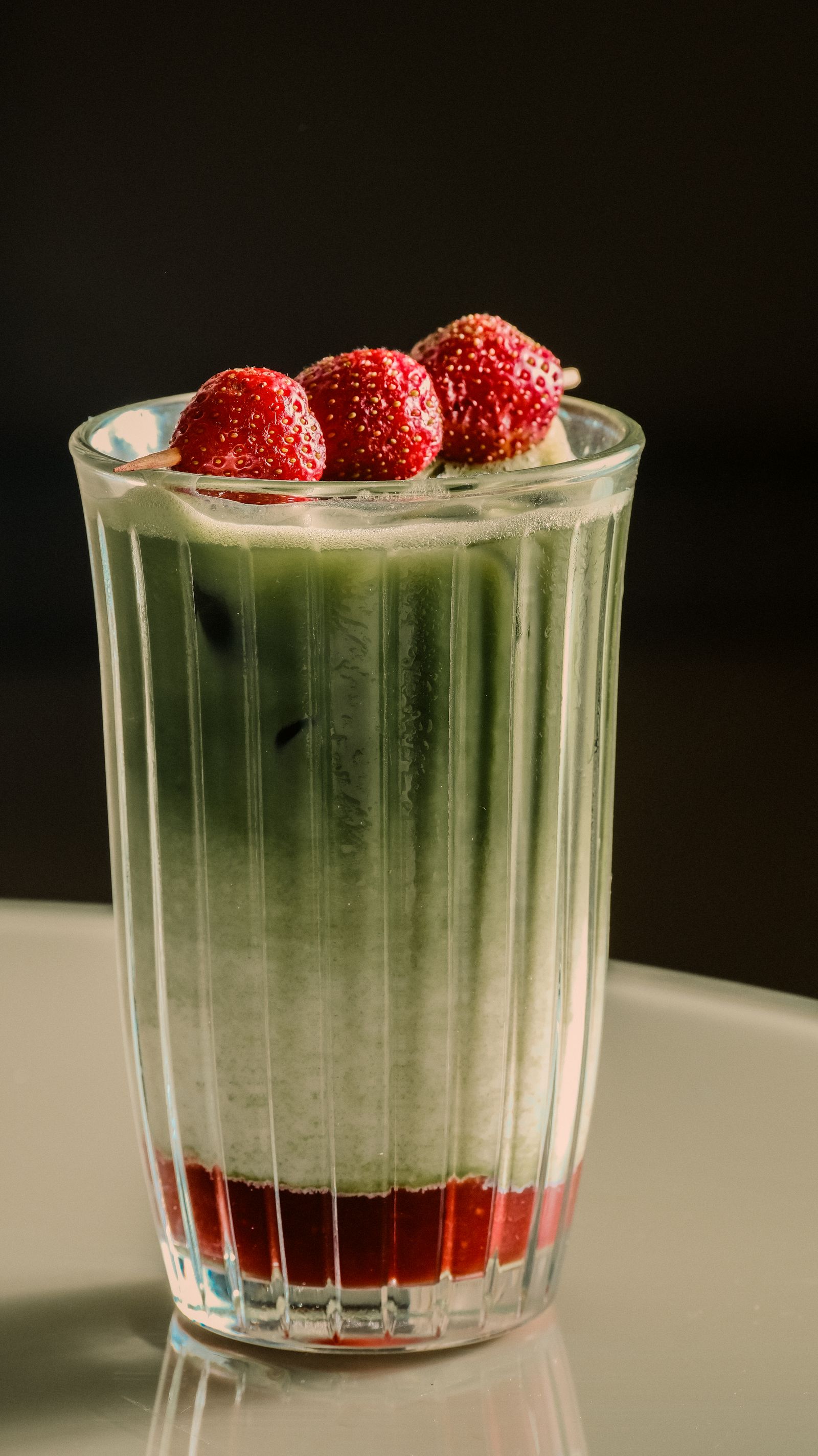 A strawberry matcha latte over ice, from the Mabel's Cafe website